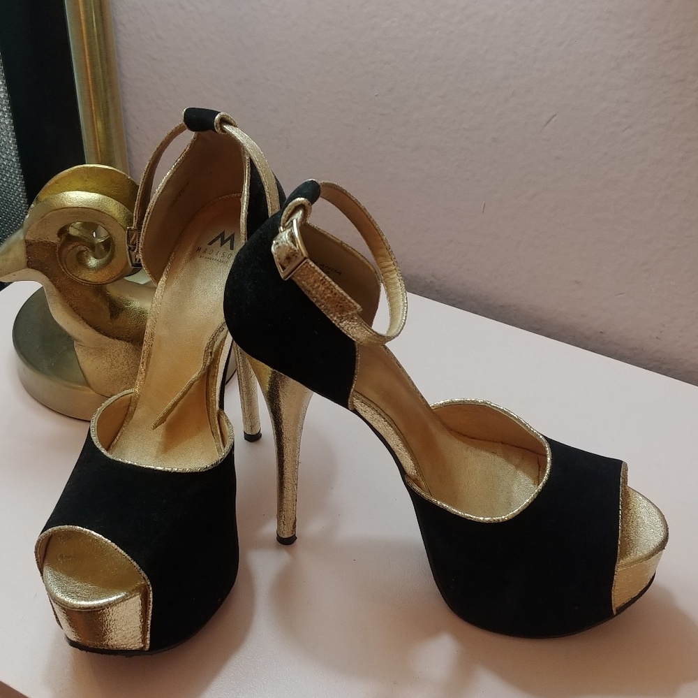 Gold and black pumps